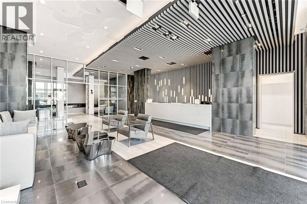 A modern living room with a black and white striped wall.
