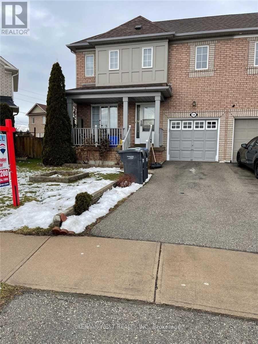 A house with a red sign in front of it.
