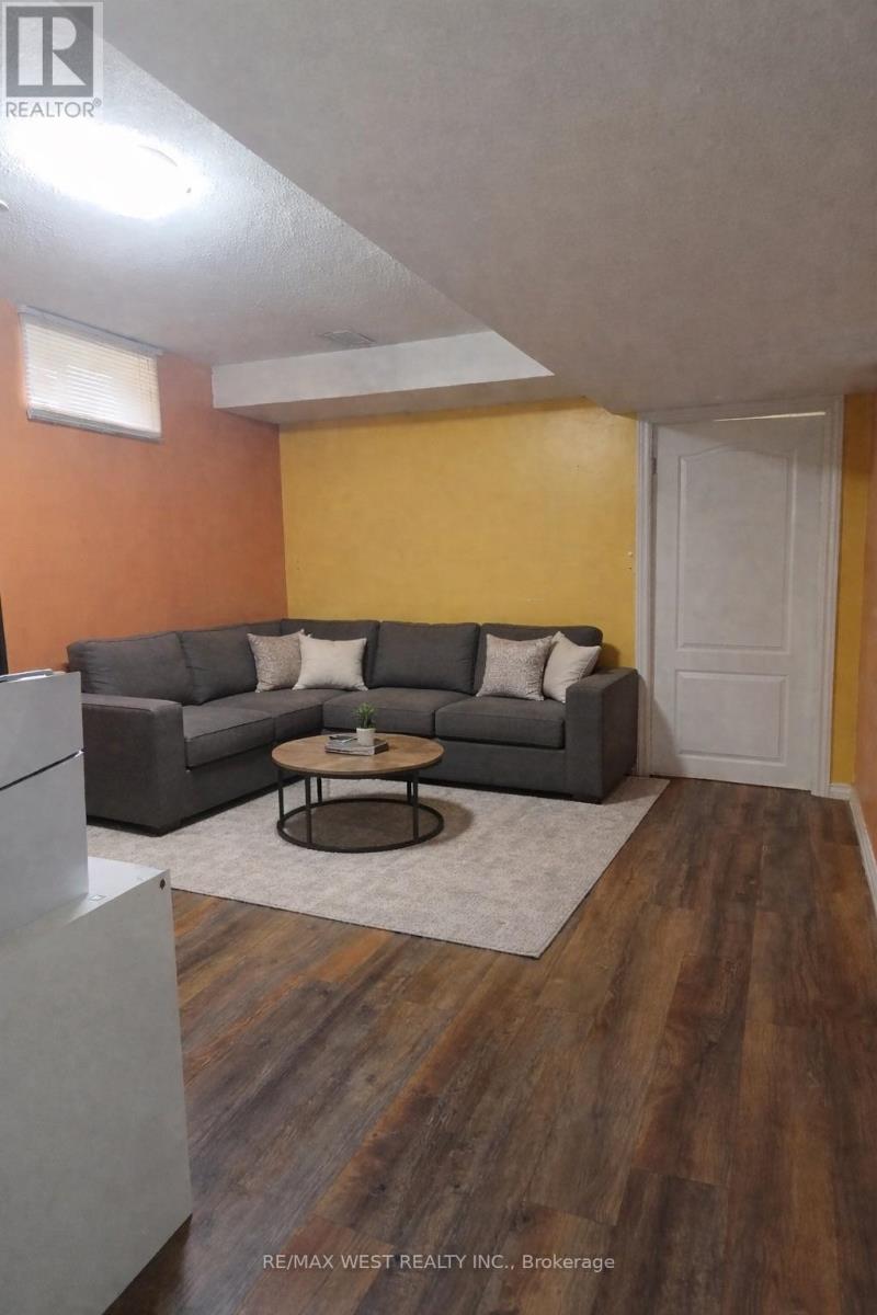 A living room with a grey couch and a coffee table.