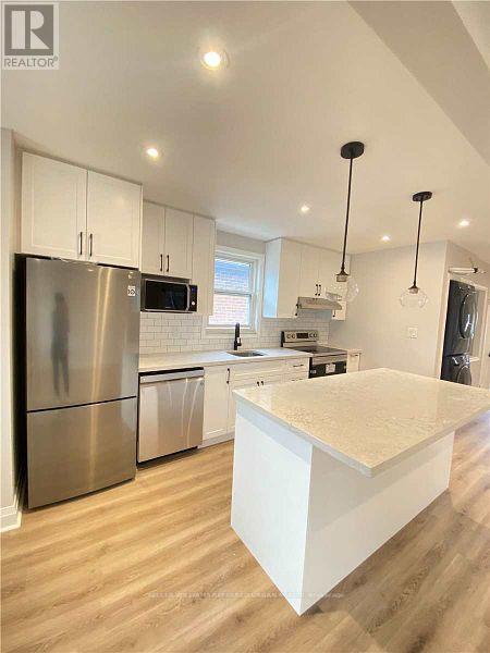 A modern kitchen with a large island in the middle.