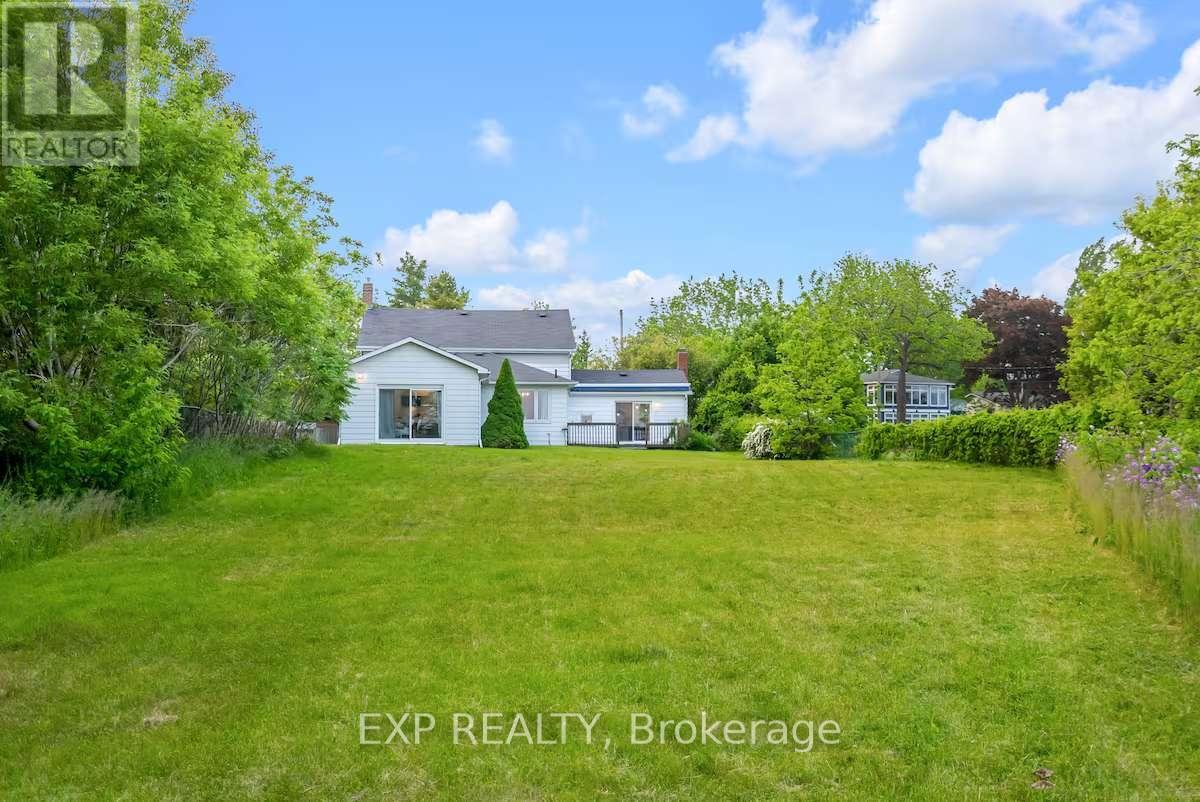 A house with a lawn in front of it is for sale.