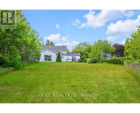 A house with a lawn in front of it is for sale.