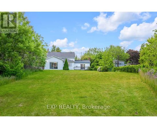 A house with a lawn in front of it is for sale.