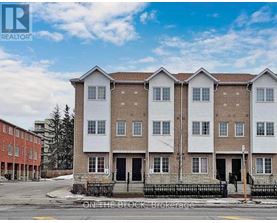 A row of townhouses with a sign that says "REALTOR" on the top left corner.