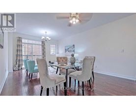 A dining room with a glass table and chairs.