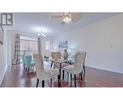 A dining room with a glass table and chairs.