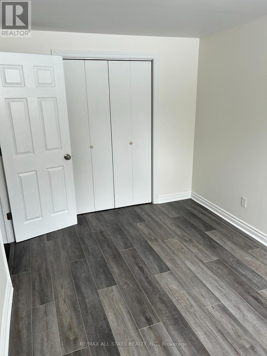 A room with a white door and a white cabinet.