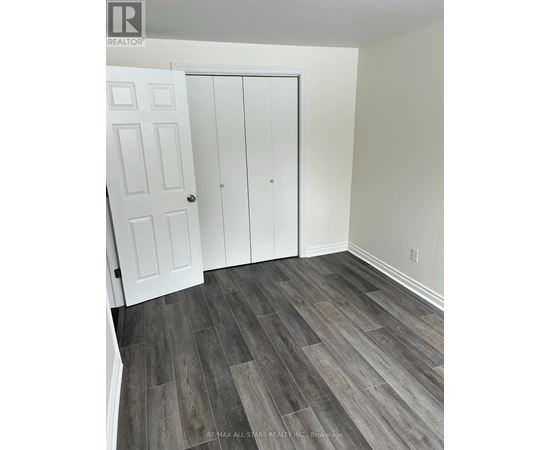 A room with a white door and a white cabinet.