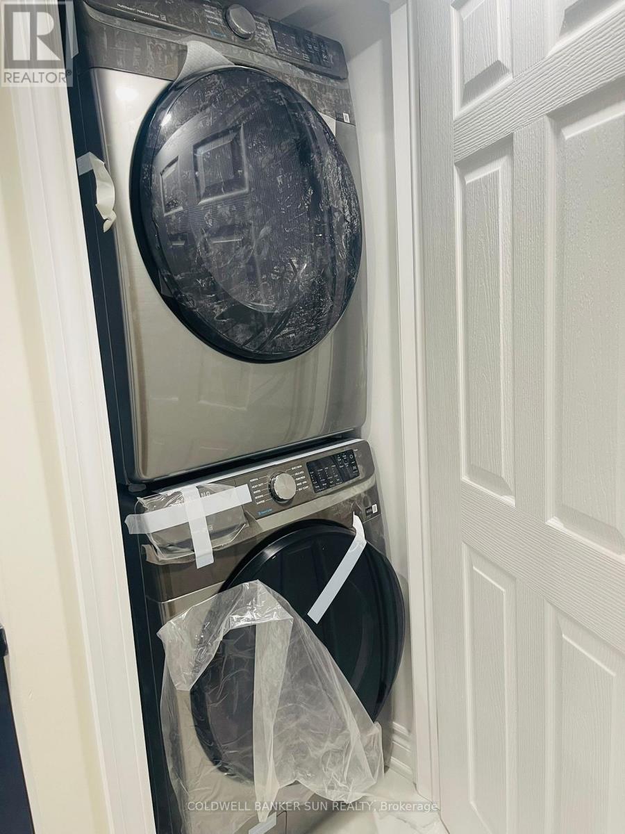 A washer and dryer in a small laundry room.