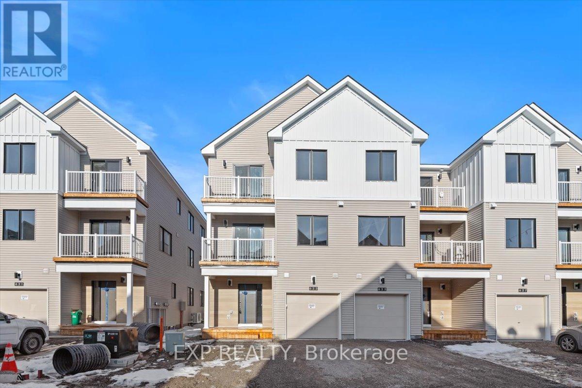 A row of new houses are being built by Exp Realty Brokerage.