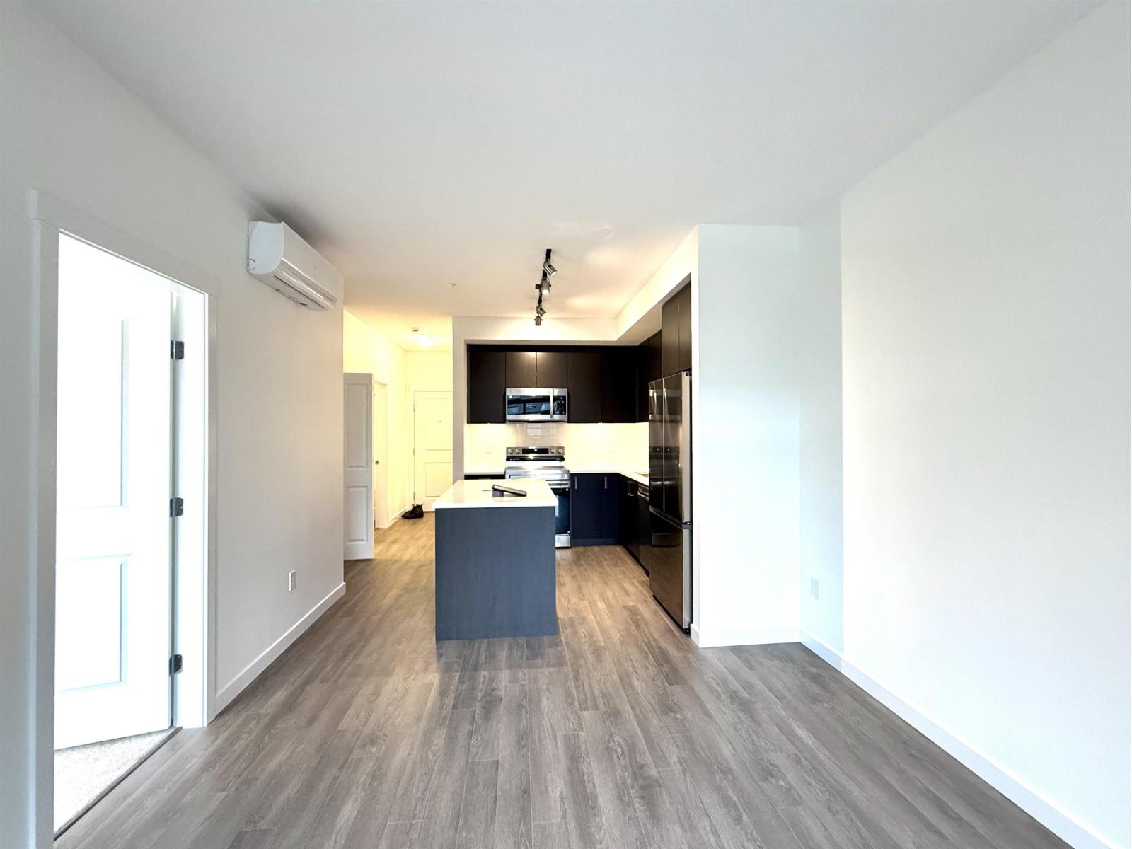 A modern kitchen with a large island in the middle.