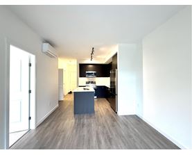 A modern kitchen with a large island in the middle.