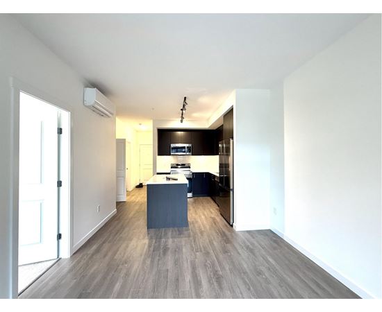 A modern kitchen with a large island in the middle.