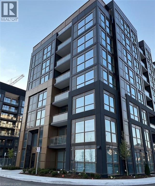 A modern multi-story building with a large number of windows.