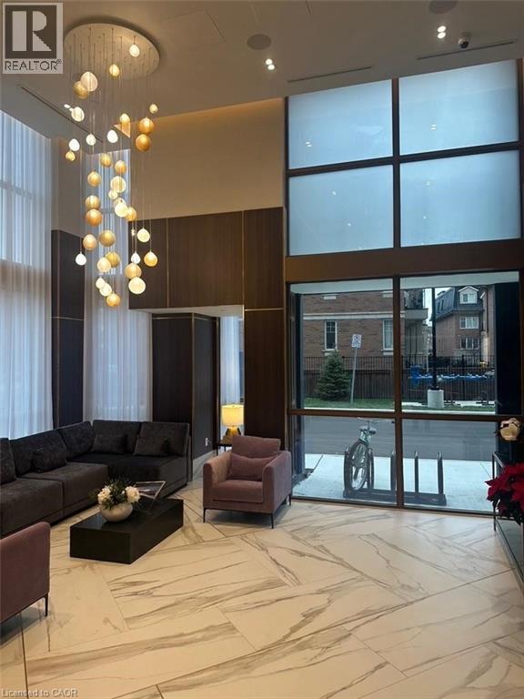 A living room with a sofa, armchair, and a coffee table.