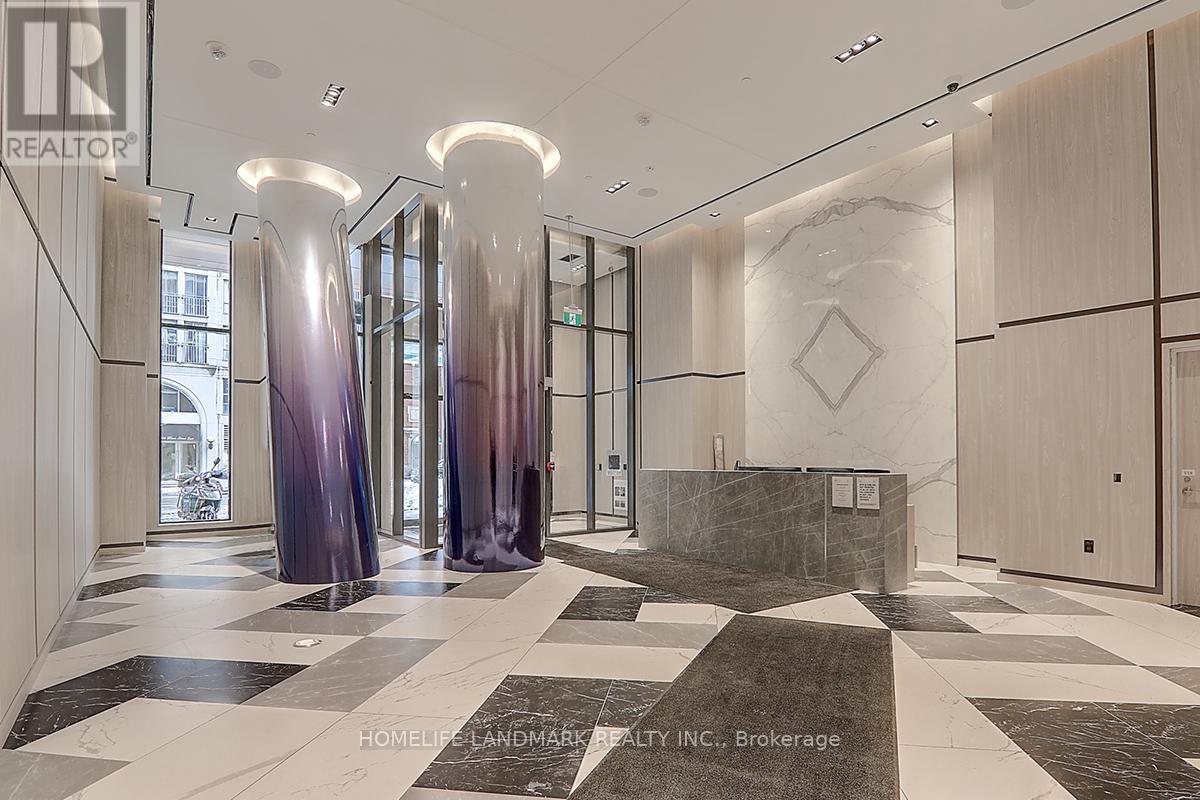 A hallway with marble floors and a checkerboard pattern.
