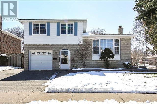 A house with a white garage door is for sale.