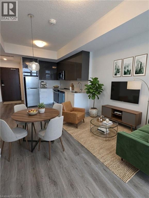 A modern living room with a dining table and chairs.