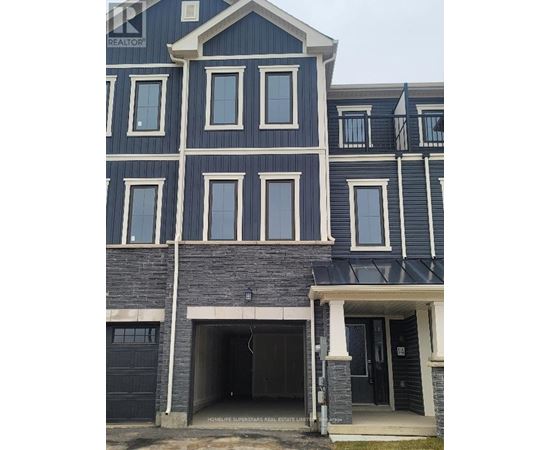 A blue house with a black garage door.