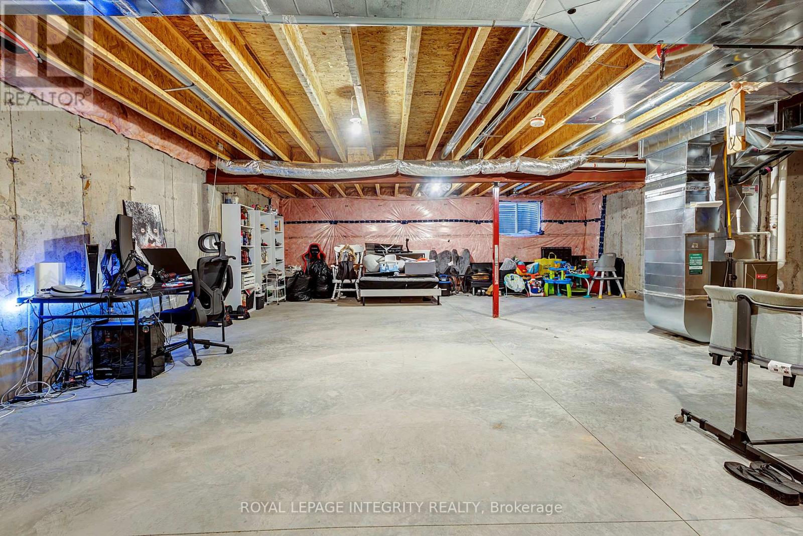 A spacious garage with a workbench and tools.