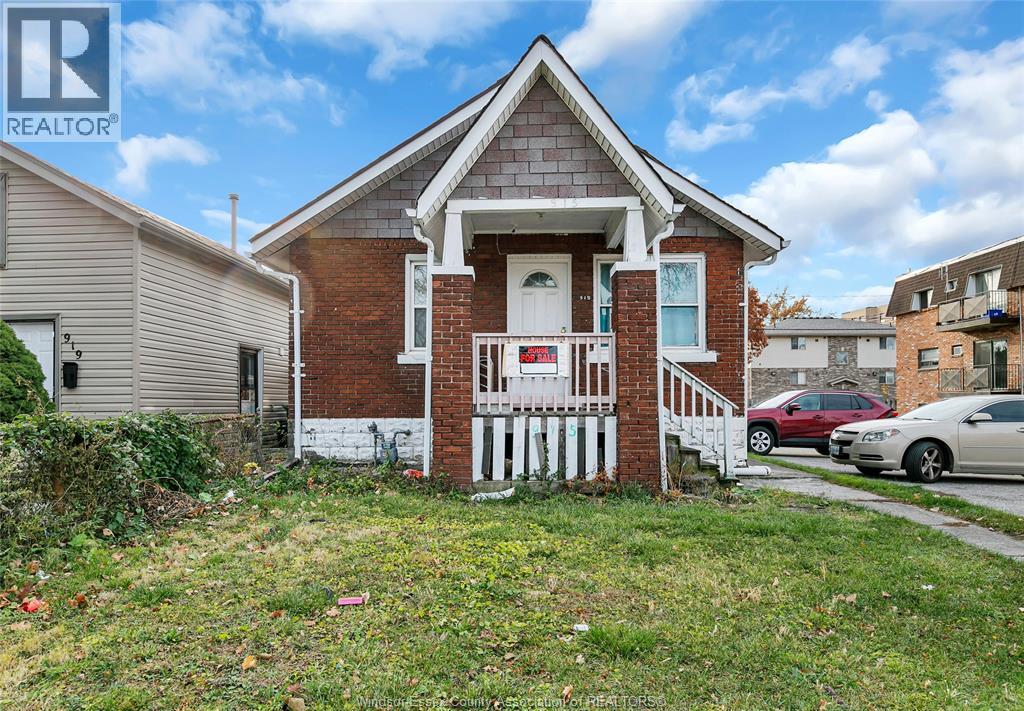 A house with a white picket fence in front of it.