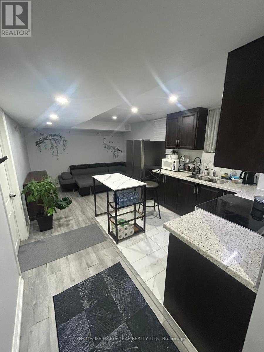 A modern kitchen with a dining table and chairs.