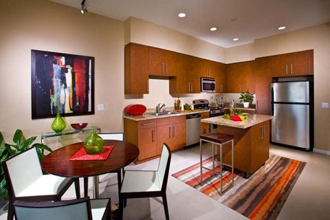 a kitchen and dining room with a table and chairs