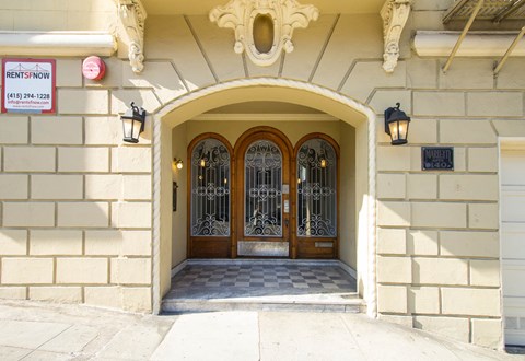 A building entrance with a sign that says RENTSNOW.