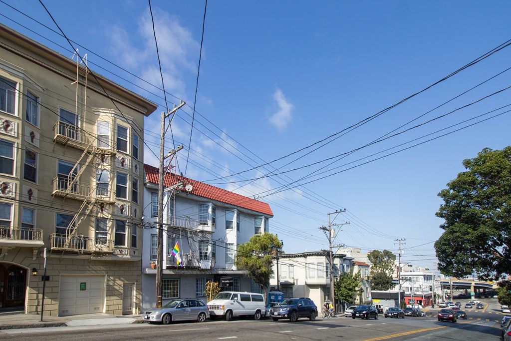 A street view with cars and buildings.