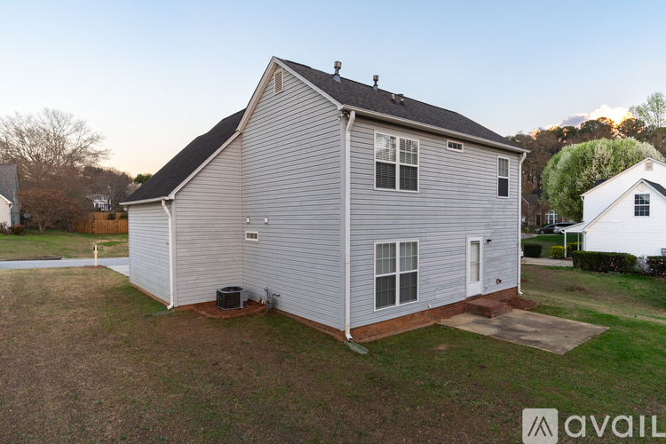 A house with a grey exterior is available for rent.