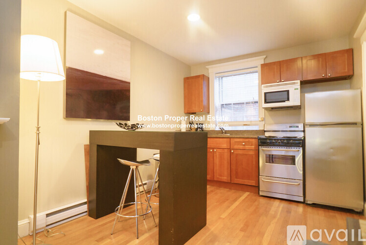A kitchen with wooden cabinets and stainless steel appliances is on the market.