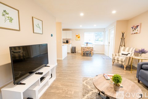 A living room with a television and a couch.