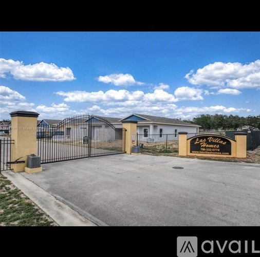 The entrance to a residential area with a sign that reads "Las Vegas.".