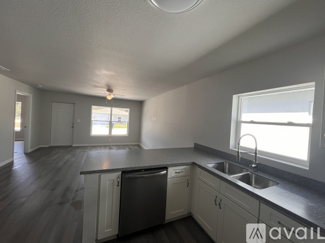 A kitchen with a dishwasher and sink.