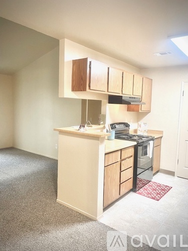 A kitchen with a stove top oven and a counter top.