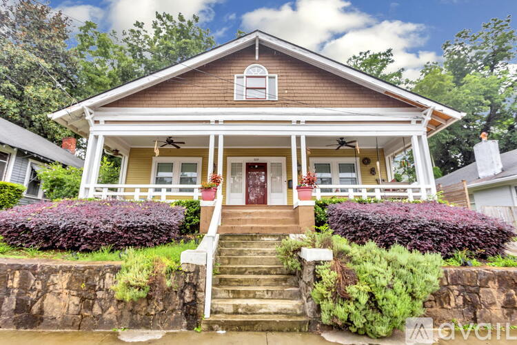 A house with a red door and a small porch.