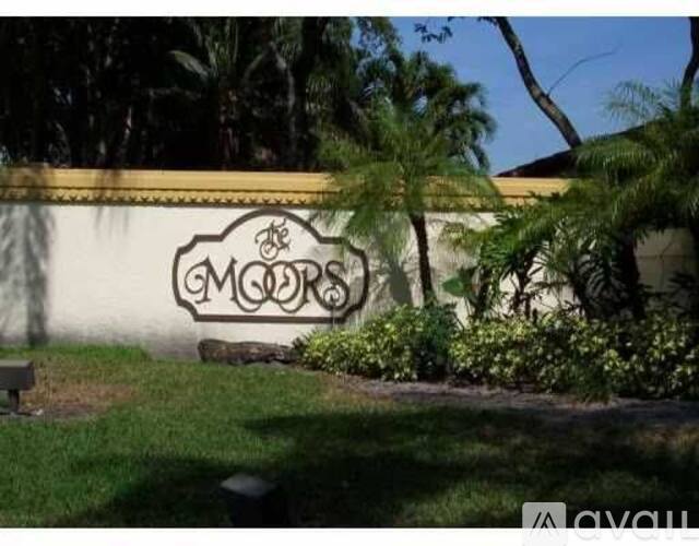 A wall with a mural of a cloud and the word "MOORS" on it.