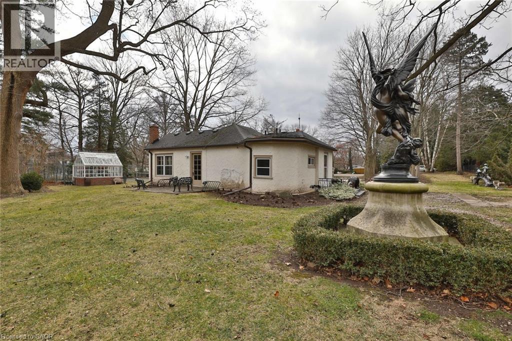 A house with a statue in front of it.