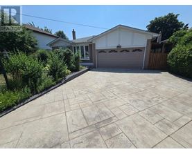 A house with a driveway in front of it.