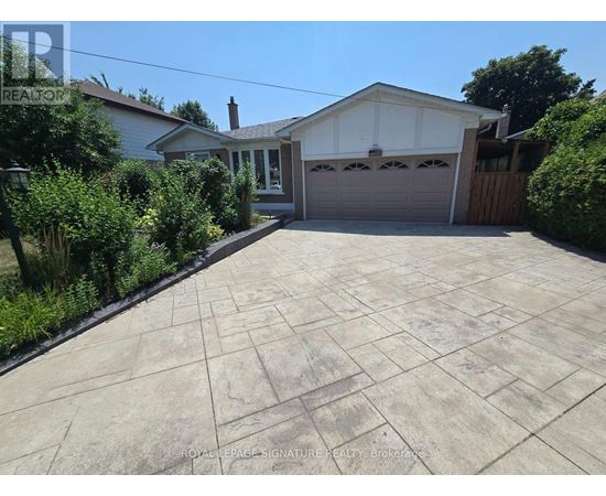A house with a driveway in front of it.