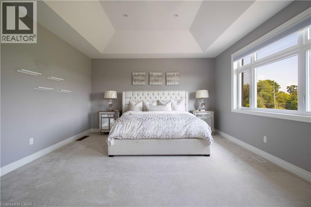 A bedroom with a large bed and a window.