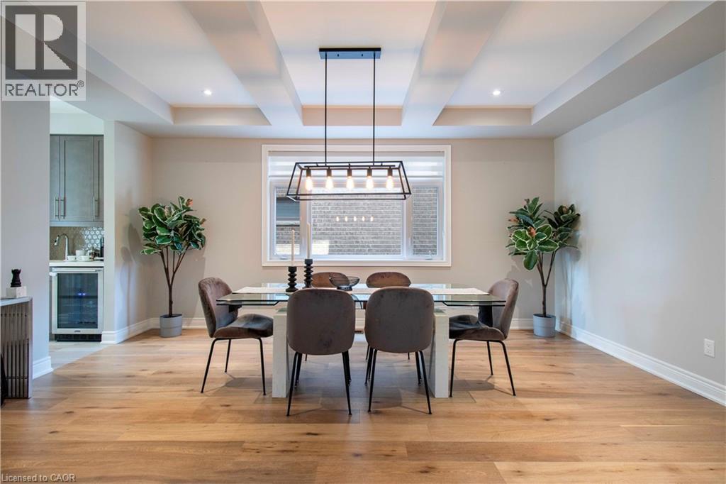 A dining room with a table set for four.