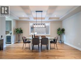 A dining room with a table set for four.