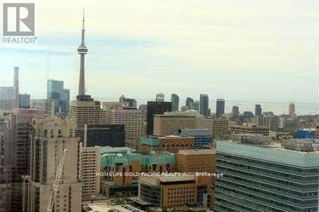 A cityscape with a tall tower in the background.