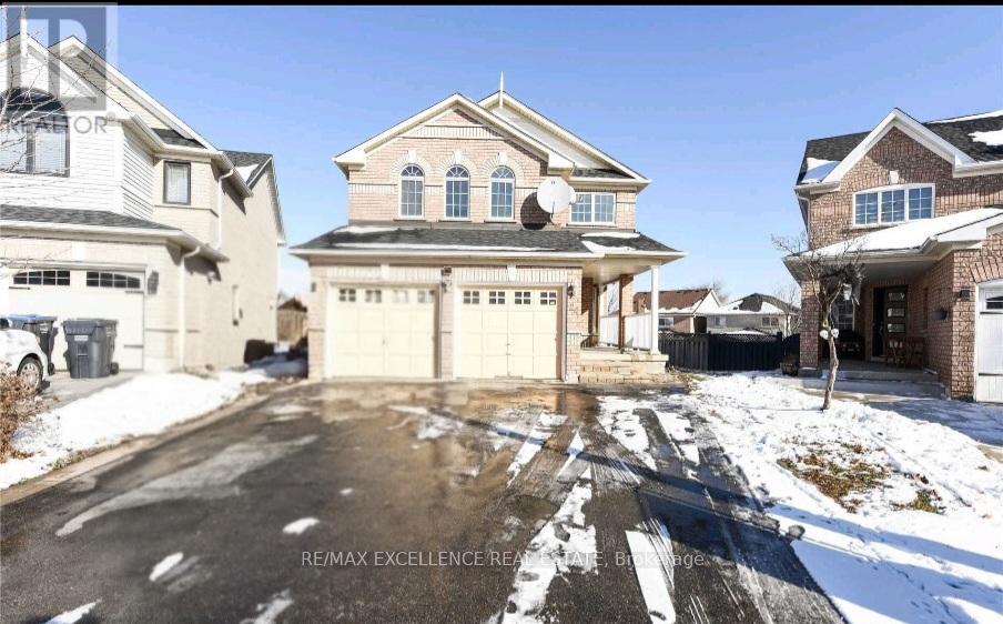 A house with a driveway in front of it.