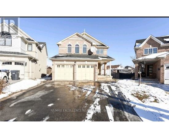 A house with a driveway in front of it.