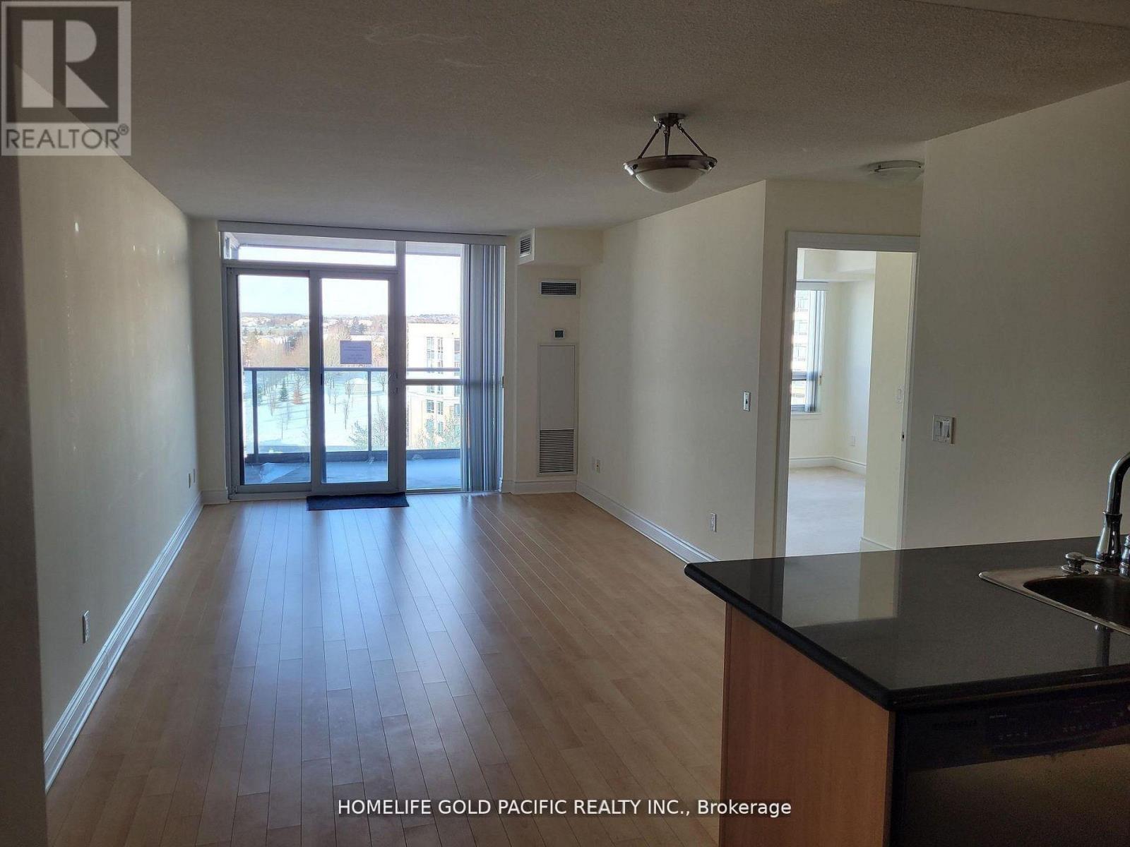 A realtor photo of a room with a sink and a window.