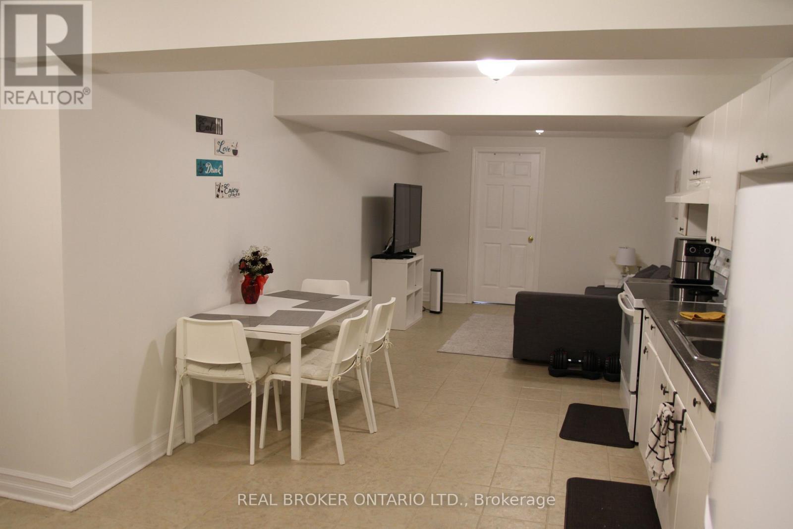 A dining room with a table and chairs is shown.