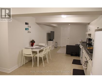 A dining room with a table and chairs is shown.