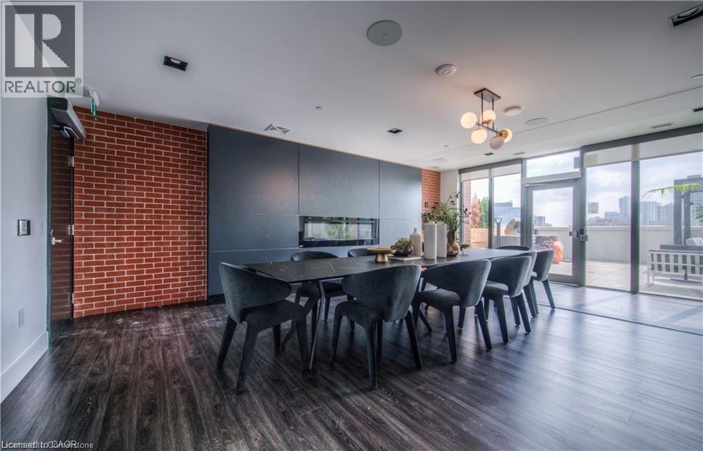 A dining room with a long table and chairs.
